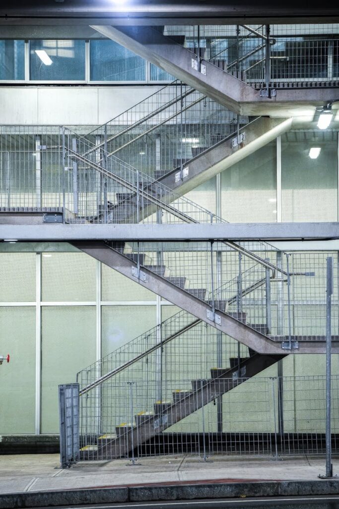 Modern industrial staircase with geometric design in urban setting.