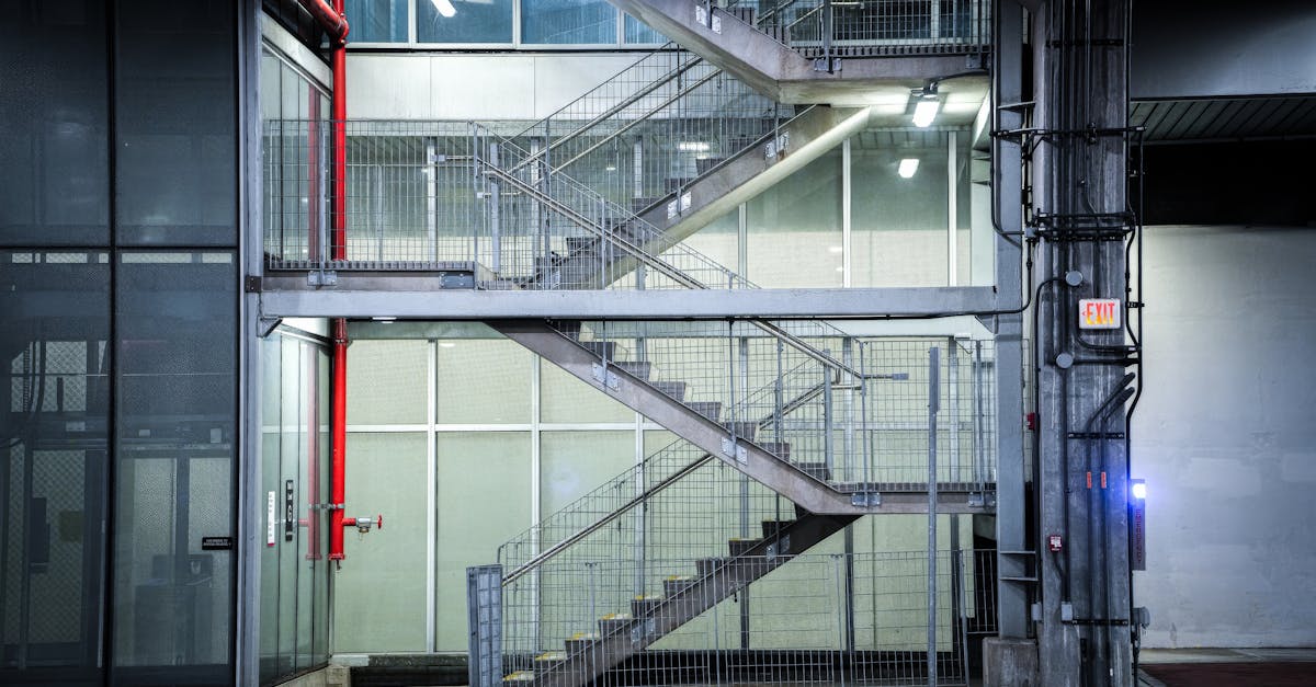 Modern industrial staircase with geometric design in urban setting.